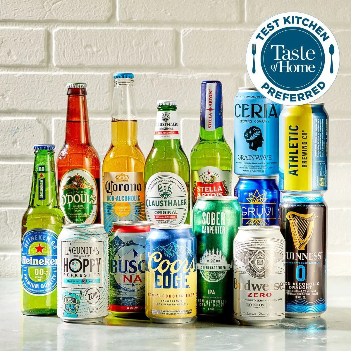 Photo of Various cans of beer and non-alcoholic beverages arranged in a group on a surface. | Wander Sober