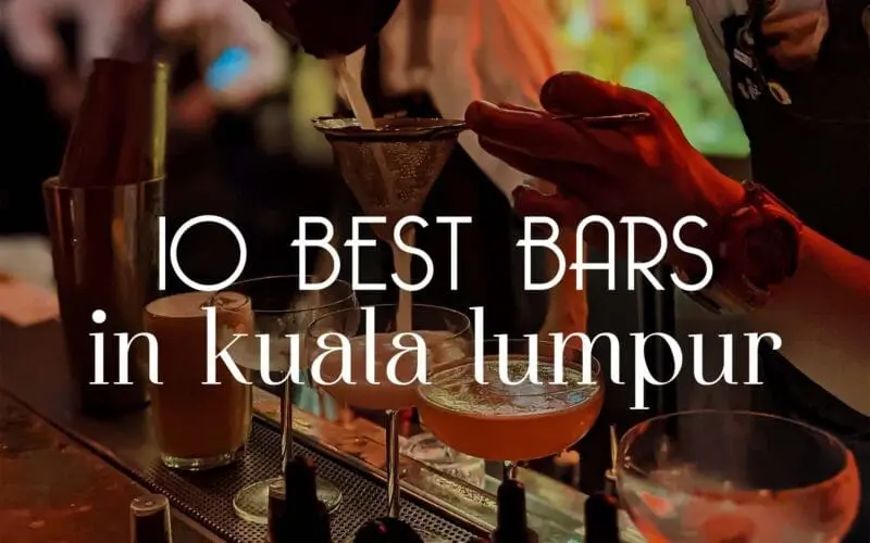Photo of Bartender pouring a cocktail through a strainer at a bar in Kuala Lumpur. | Wander Sober