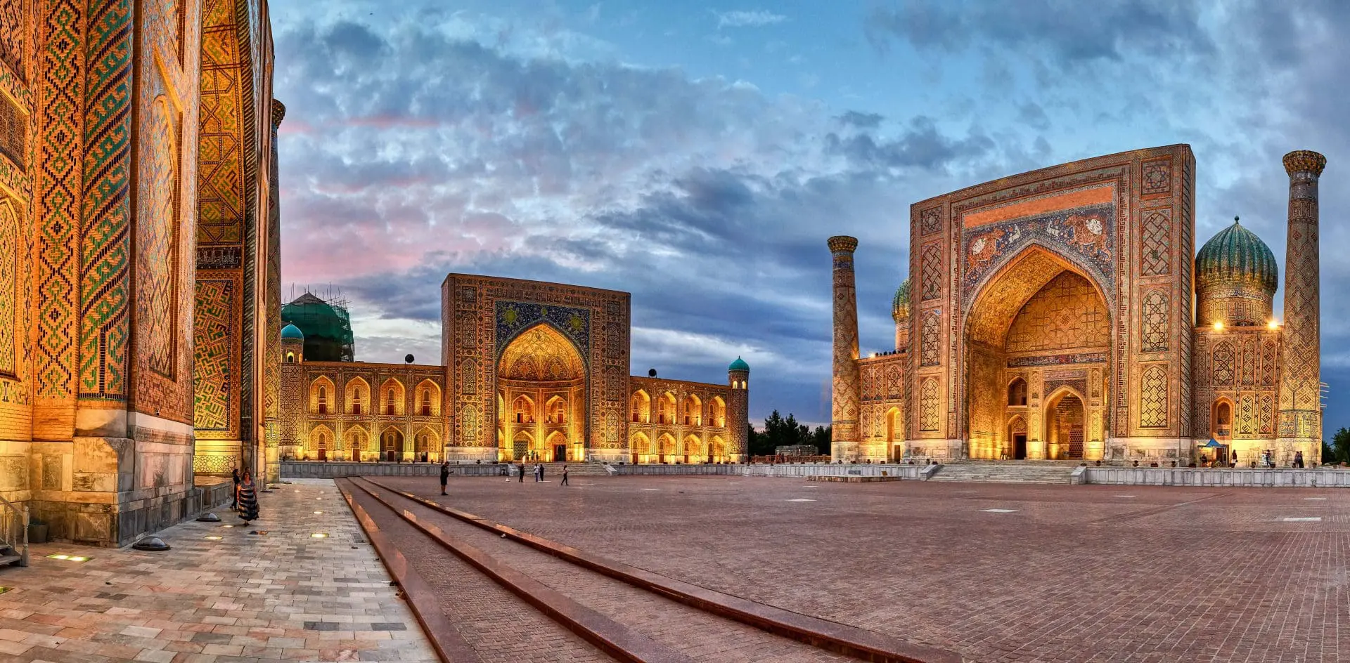 Photo of Panoramic view of Registan Square featuring three ornate madrasahs in Samarkand, Uzbekistan. | Wander Sober