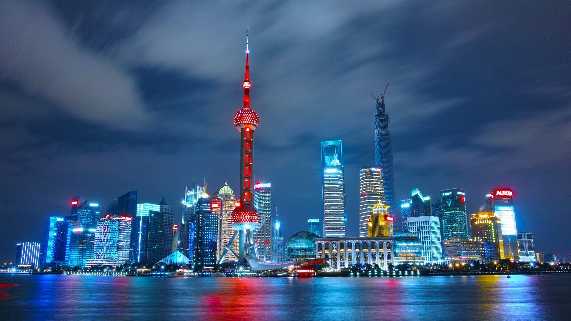 Photo of Night view of Shanghai skyline featuring the Oriental Pearl Tower and modern skyscrapers. | Wander Sober